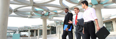 Three men discussing design strategies