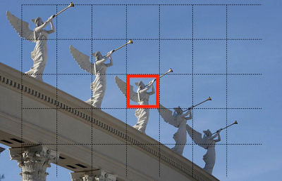 Image of stone angels with grid overlay showing spot metering around a specific point framed by a red square