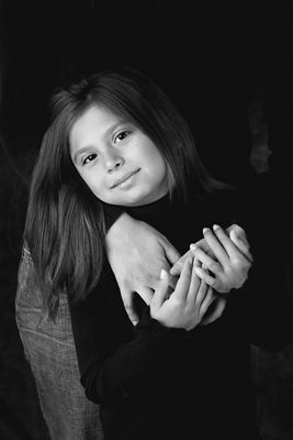 photo of young girl being hugged with high black and white contrast