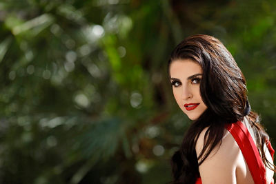 Girl off to the right looking back at the camera with a blurry background