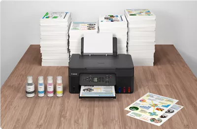 PIXMA G3270 - Front View in Front of Many Stacks of Printed Flyers