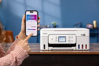 PIXMA G3290 - Person Holding Phone Next to Printer