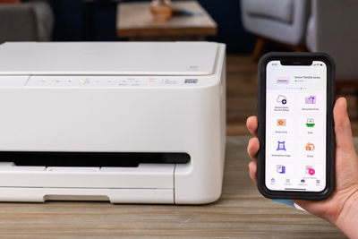PIXMA TS4320 - Person Using Mobile Device to Print