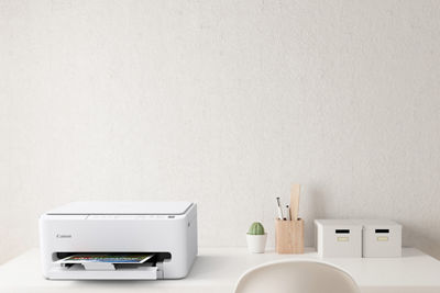 PIXMA TS4320 - Printer Printing on a Desk