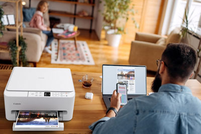 PIXMA TS6520 - Person Using Printer on a Desk