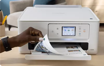 PIXMA TS7720 - Person Retrieving a Two-Sided Print