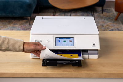 PIXMA TS8820 - Person Grabbing 2-Sided Printed Paper