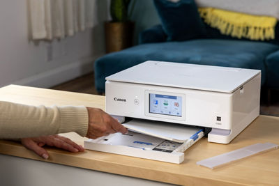 PIXMA TS8820 - Person Loading Paper on Bottom Tray