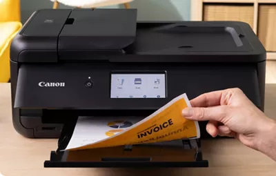 PIXMA TS9520a - Person Printing a 2-Sided Paper