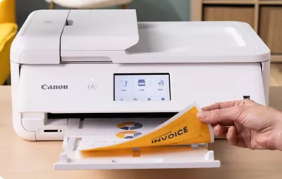 PIXMA TS9521Ca - Person Printing a 2-Sided Paper