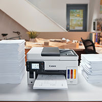 Printer in Between Stacks of Paper