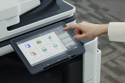 Office Worker Next to Canon Printer