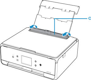 Feed slot cover (C) shown in open position
