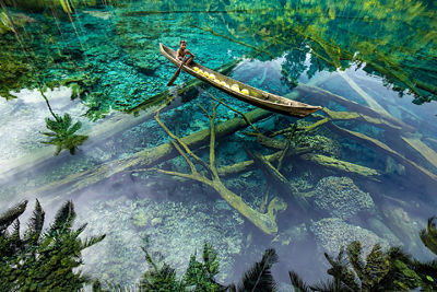 Person Rowing a Canoe