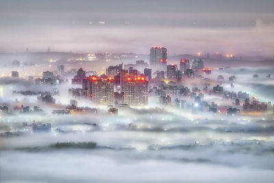 Picture of a City With Clouds Around It