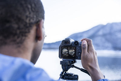 Person Using Canon Camera to take Picture