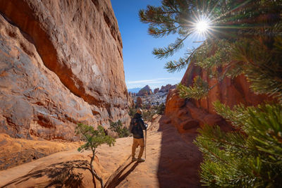 Person Standing In Between Rocks