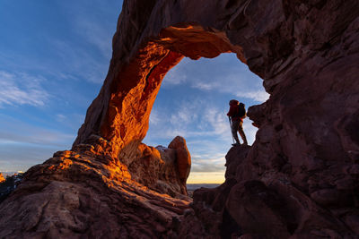 Person Standing on Rock Formation