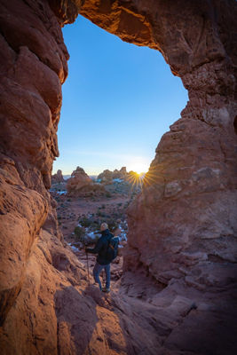 Person Standing on Rock Formation