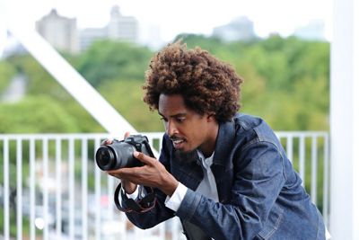 Person Using a Camera with RF16-28mm F2.8 IS STM to Take a Picture