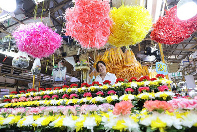 Person Surrounded by Different Flowers