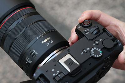 Person Holding a Camera with RF20-50mm F4 L IS USM PZ Lens Attached