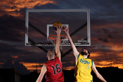 Two People Playing Basketball