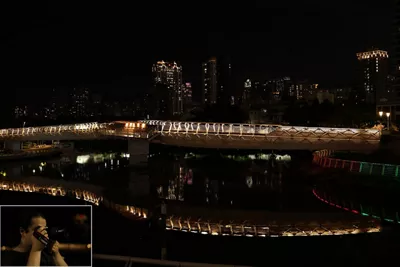 Person Taking a Picture of a City