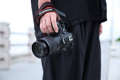 Person Holding Camera with RF28-70 F2.8 IS STM