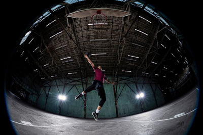 Normal View of a Skateboarder Jumping Over a Fire Hydrant