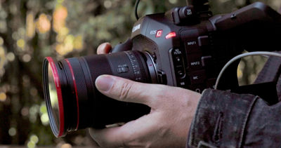 Person Using Lens with Cinema Camera