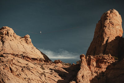 Slackliner crossing two mountains