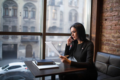Woman in business office at her desk