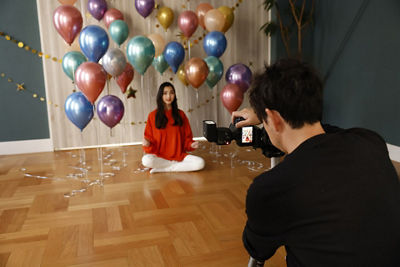 Speedlite EL-10 - Person Posing for a Picture in Front of Balloons