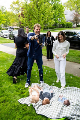 Couple Taking Picture of a Baby