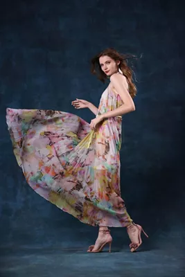 Model Posing in a Pink Floral Dress