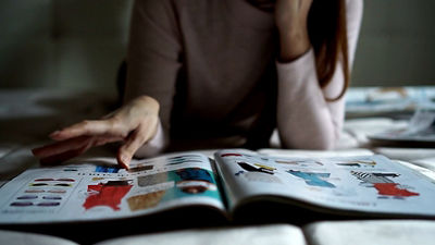 Person Looking at a Magazine