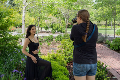 Photo of a woman posing in the grass