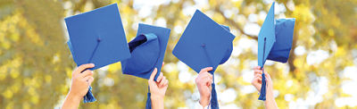 Graduation hats in the air