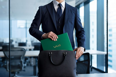 Person Pulling Out a VAIO Laptop From Their Bag