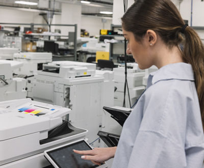 Woman working at a Canon printer