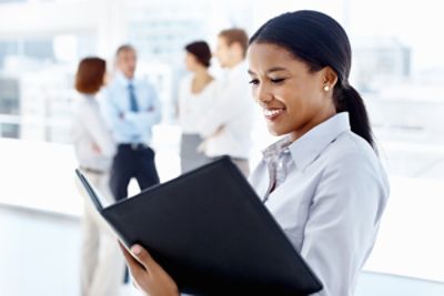 Business Woman looking through folder