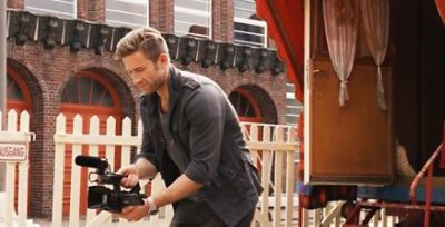 Man walking with camcorder recording