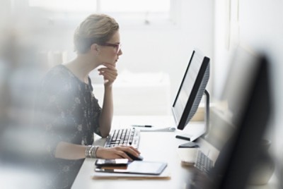 Business woman working on computer in office