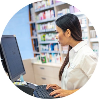 Pharmacist using computer