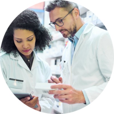 Two pharmacists looking at a tablet