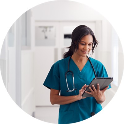 Woman nurse looking at tablet