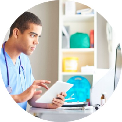 Male nurse using tablet