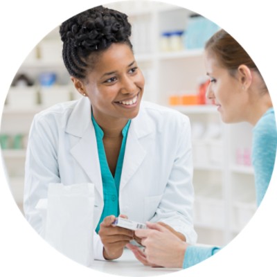 Pharmacist showing medication to customer