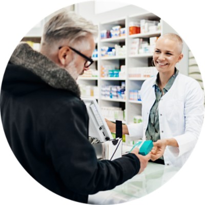  Pharmacist showing medication to customer
